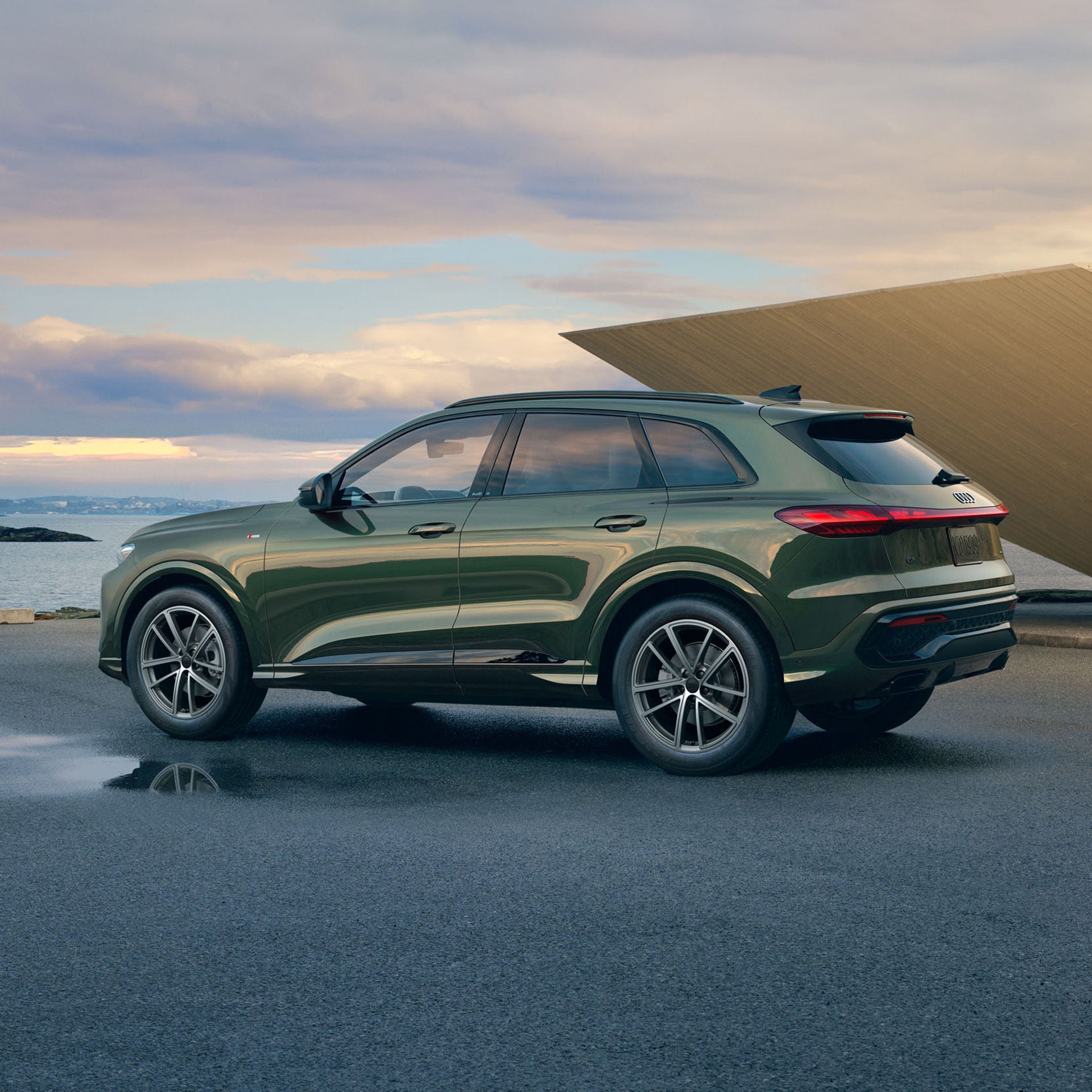 Side profile view of an Audi Q5 parked.